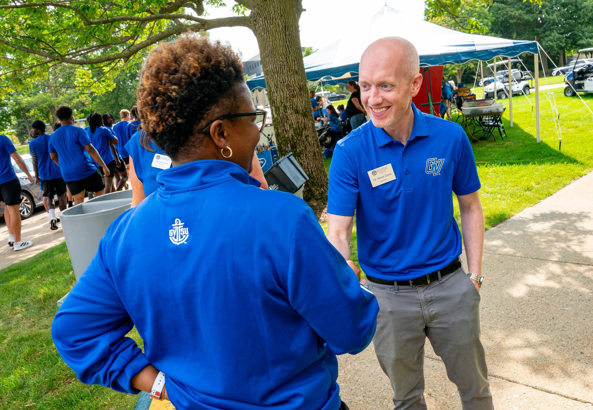 Kevin Conn, assistant vice president for Student Affairs, Housing and Residence Life, talks with Myesha Gholston, director of the Laker Academic Advising Center, during the first day of move-in on the Valley Campus.